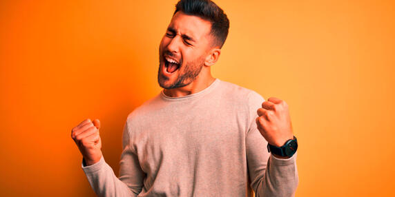 Happy man celebrating